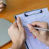 close-up-clipboard-in-a-hand-manager-write-take-note-candidate-i